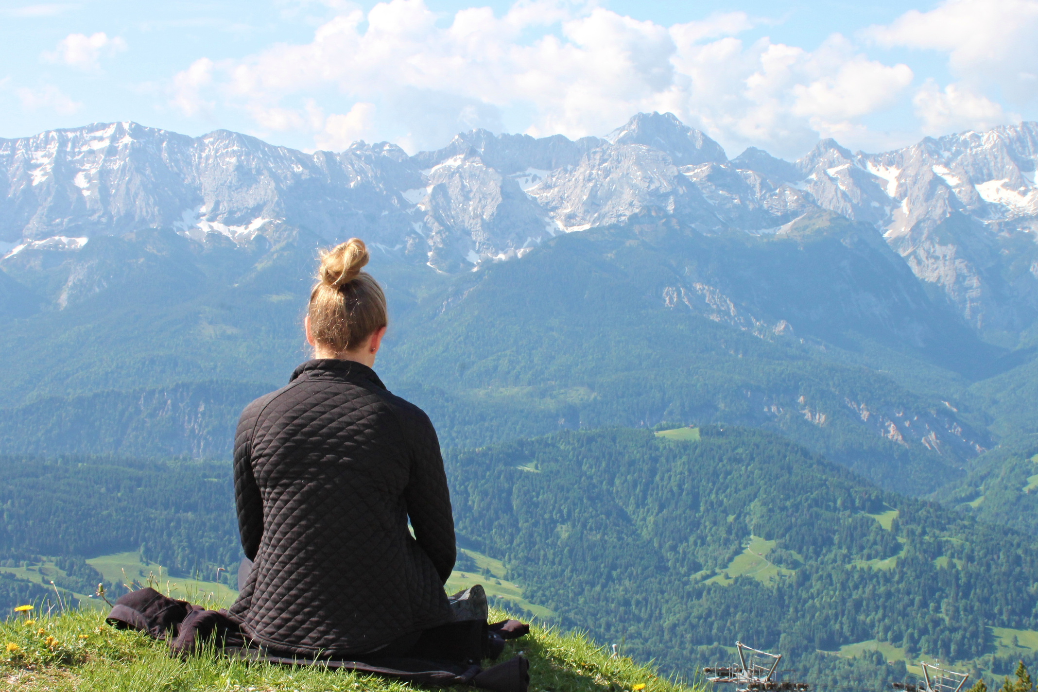 Woman Sitting in the Mountains
